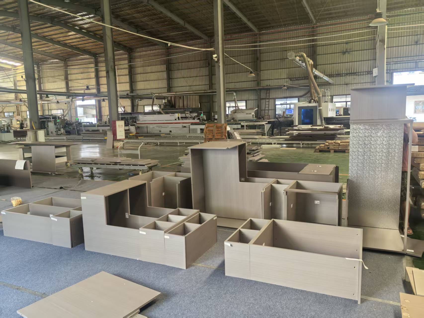 Cabinet components on a furniture factory production floor