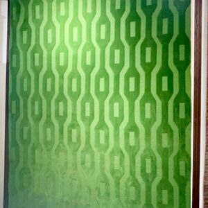 Green Geometric Pattern Rug displayed on a carpet showroom rack, model CR-013