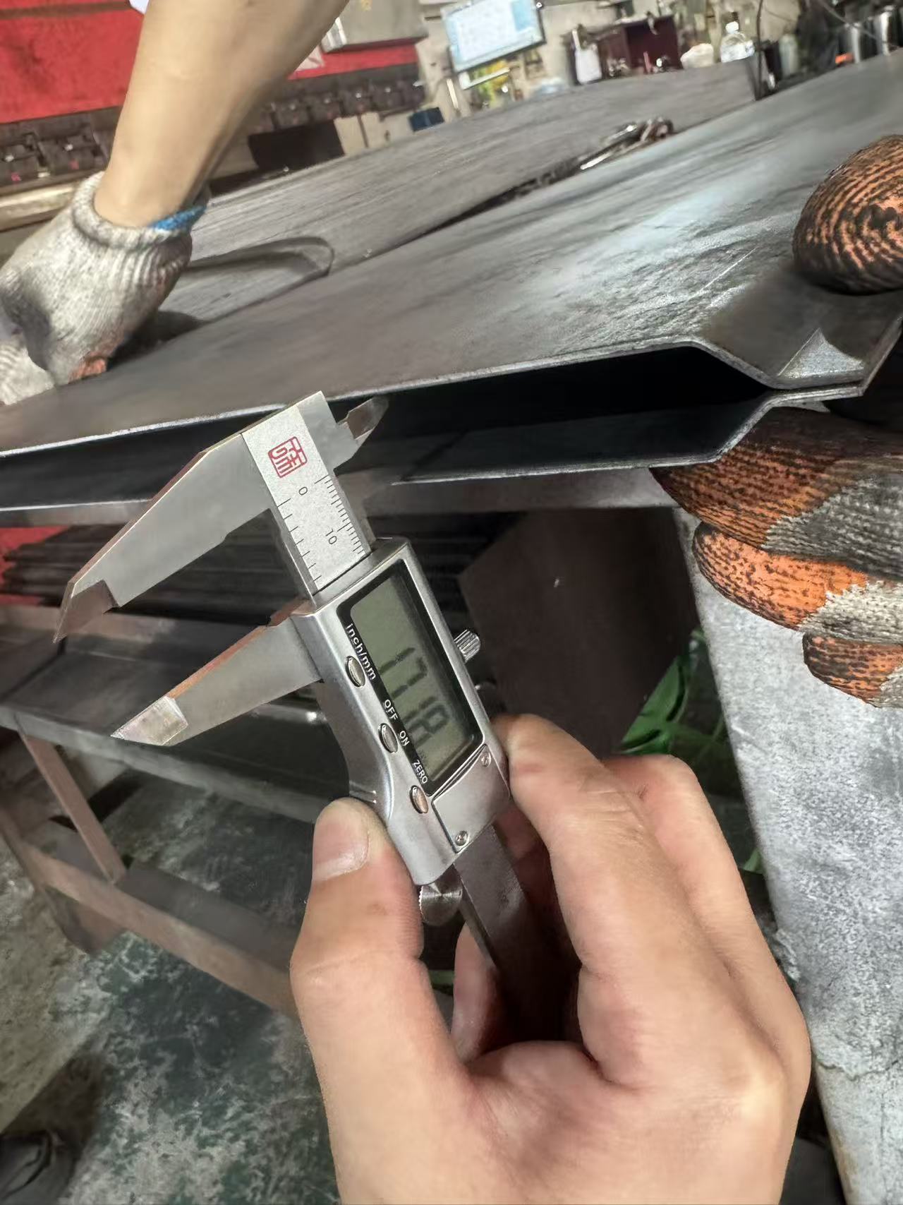 Checking a metal component with a digital caliper
